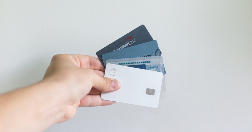Student holding a credit card — F1 visa credit card options