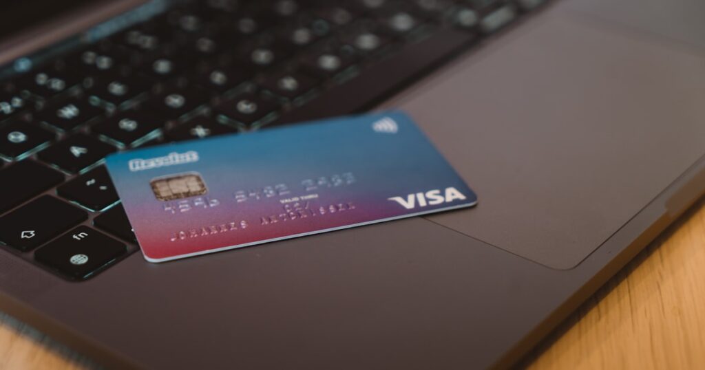 Professional using a credit card — best credit cards for H1B visa holders